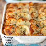 Crispy scalloped potato topped sausage hotpot with cider onion gravy featuring a title overlay.