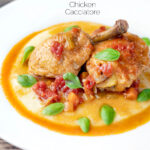 Lighter slow cooker chicken cacciatore served with cheesy polenta featuring a title overlay.