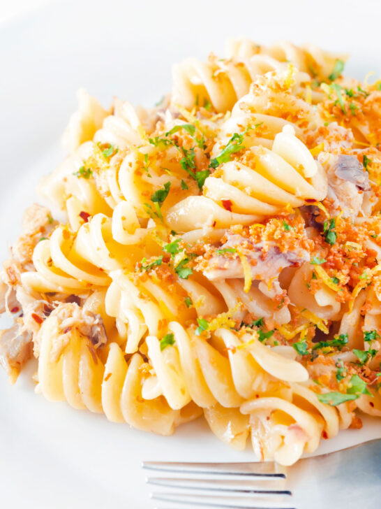 Close up spicy smoked mackerel pasta with fusilli, chilli, lemon and golden breadcrumbs.
