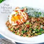 Thai minced pork with coriander rice and a fried egg featuring a title overlay.