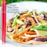 Vegan yaki udon noodles with shiitake mushrooms, carrots and pak choi featuring a title overlay.