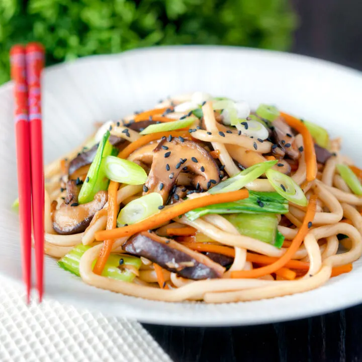 Vegetarian yaki udon noodles with shiitake mushrooms and pak choi.