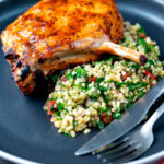 Rose harissa glazed roasted pork chops with bulgur wheat salad.
