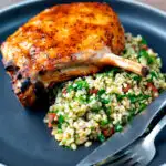 Rose harissa glazed roasted pork chops with bulgur wheat salad featuring a title overlay.