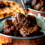 Indian-inspired beef vindaloo curry with rice featuring a title overlay.