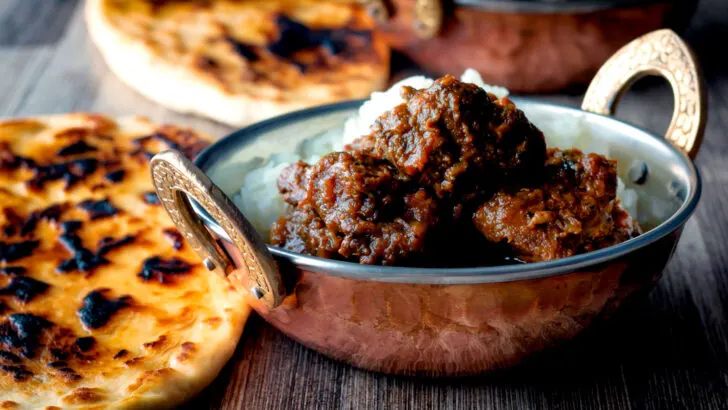 Indian-inspired beef vindaloo curry with tandoori naan bread.