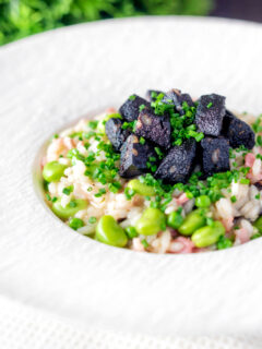 Black pudding risotto with bacon, broad beans and garden peas.