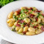Creamy blue cheese gnocchi with stilton, asparagus and bacon.
