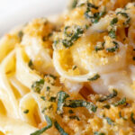 Close up blue cheese pasta with fettuccini and a crispy golden sage crumb.