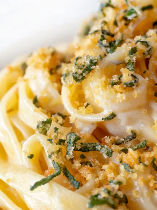 Close up blue cheese pasta with fettuccini and a crispy golden sage crumb.