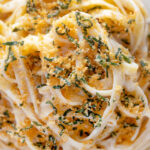 Close up overhead blue cheese pasta with fettuccini and a crispy golden sage crumb.
