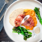 Overhead chicken Balmoral with whisky cream sauce, carrot and swede mash & broccoli featuring a title overlay.