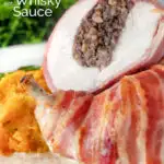 Close-up bacon-wrapped chicken Balmoral stuffed with haggis and a whisky cream sauce featuring a title overlay.