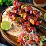 Chicken shashlik kebab sticks with chapatis and kachumber salad.