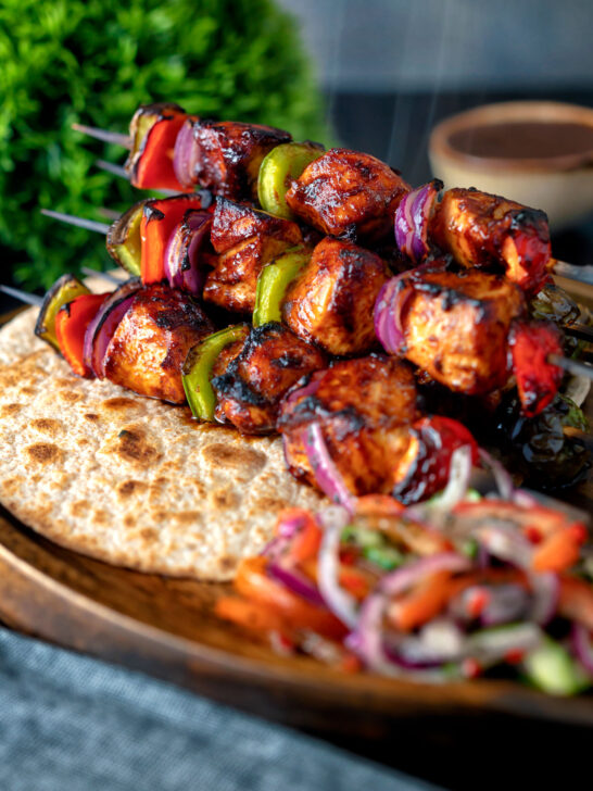 Spicy chicken shashlik kebab sticks with chapatis and kachumber salad.