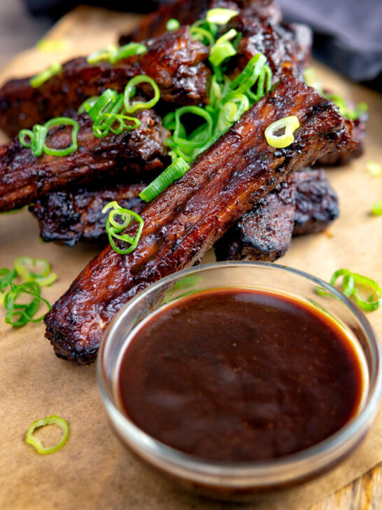 Chinese takeaway style spare ribs with a dipping sauce.