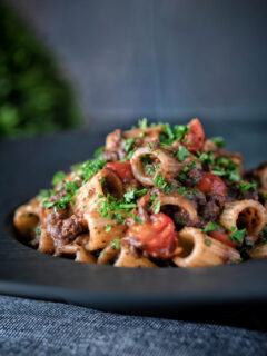 Haggis pasta bolognese with mezzi rigatoni in red wine sauce with cherry tomatoes.