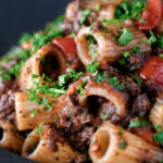 Haggis pasta bolognese with mezzi rigatoni with cherry tomatoes.