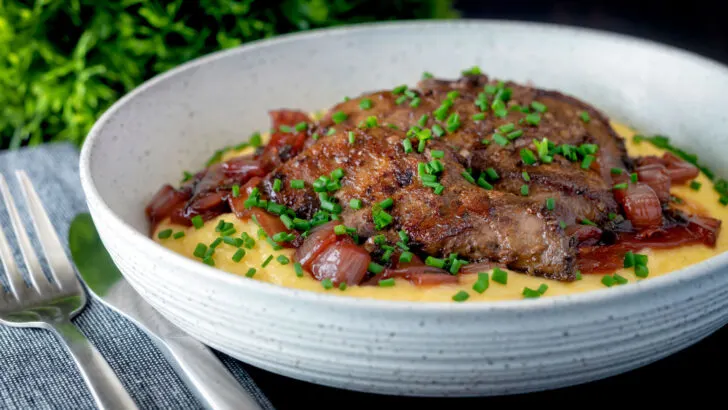Pan fried lambs liver and sticky port onions on cheesy polenta with chives.