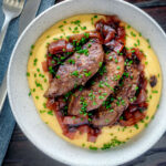 Overhead fried lambs liver and port onions on polenta.