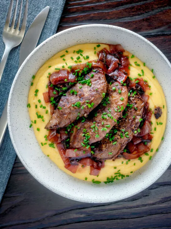 Overhead fried lambs liver and port onions on polenta.