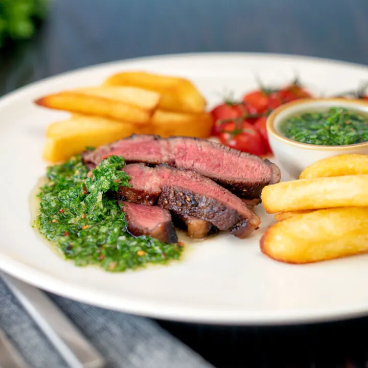 How to cook rare rump steak with chimichurri sauce, tomatoes and chips.