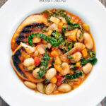 Overhead quick Italian ribollita bean soup from Tuscany with toasted bread featuring a title overlay.