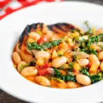 Quick Italian ribollita bean soup from Tuscany with toasted bread featuring a title overlay.