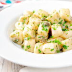 Ricotta cheese gnocchi with caper butter sauce.