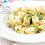 Ricotta cheese gnocchi with caper butter sauce featuring a title overlay.
