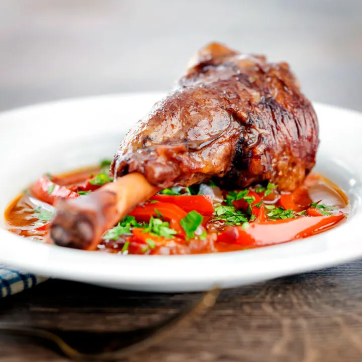 Slow cooker lamb shanks in a red wine, tomato and pepper sauce.
