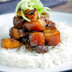 Sticky pork belly with pineapple and soy sauce served with rice featuring a title overlay.