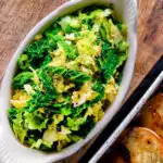 Overhead sauteed buttered savoy cabbage with fennel seeds.