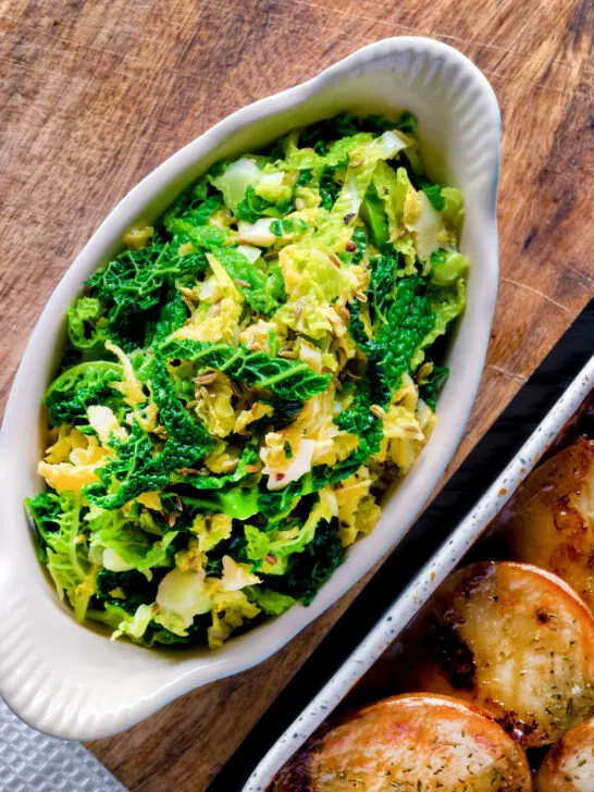 Overhead sauteed buttered savoy cabbage with fennel seeds.