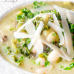 Close-up quick cabbage and cannellini bean soup with potatoes and capers featuring a title overlay.