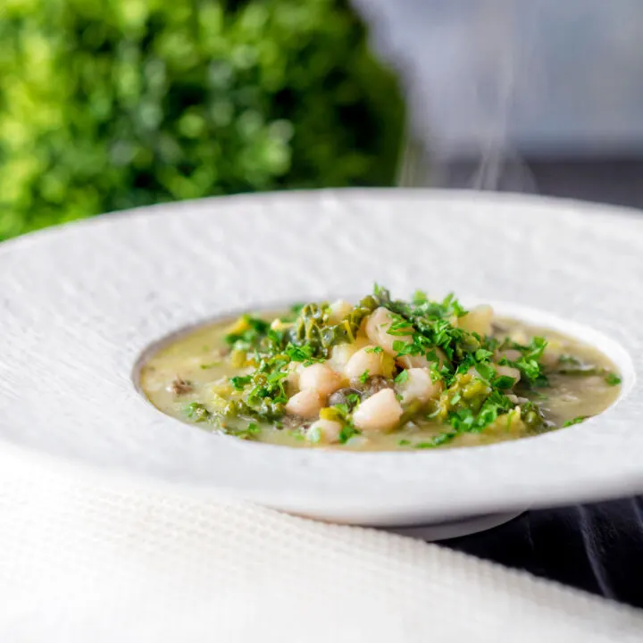 Savoy cabbage and white bean soup with potatoes and capers.