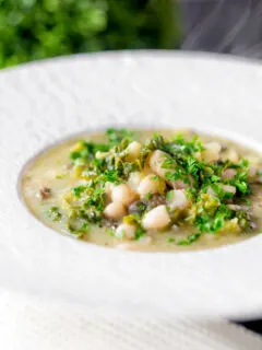 Quick cabbage and white bean soup with potatoes and capers.