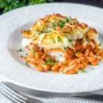 Cheesy mashed potato topped fish finger and baked bean pie.