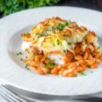 Cheesy mashed potato topped fish finger and baked bean pie featuring a title overlay.