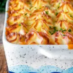 Fish finger and baked bean pie topped with cheesy mash.