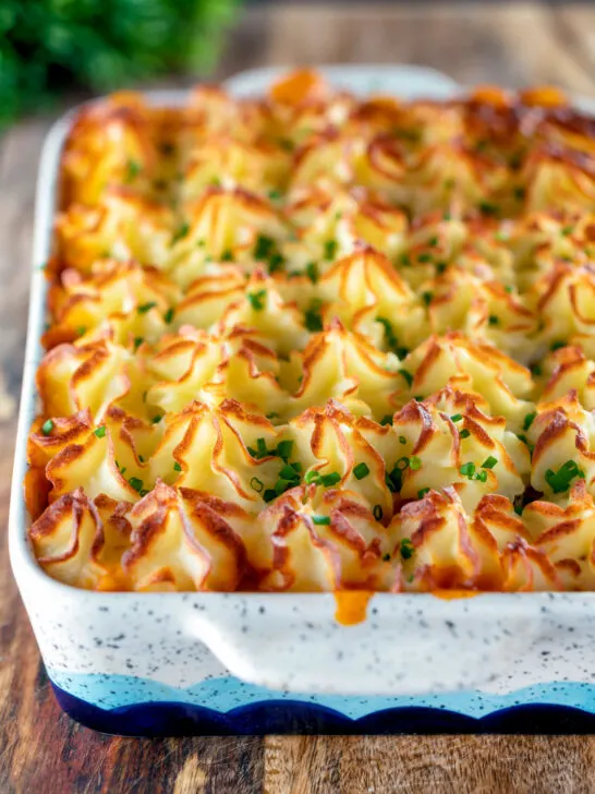 Fish finger and baked bean pie topped with cheesy mash.