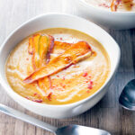 Silky Smooth roasted curried parsnip soup with paprika and fried carrot crisps.