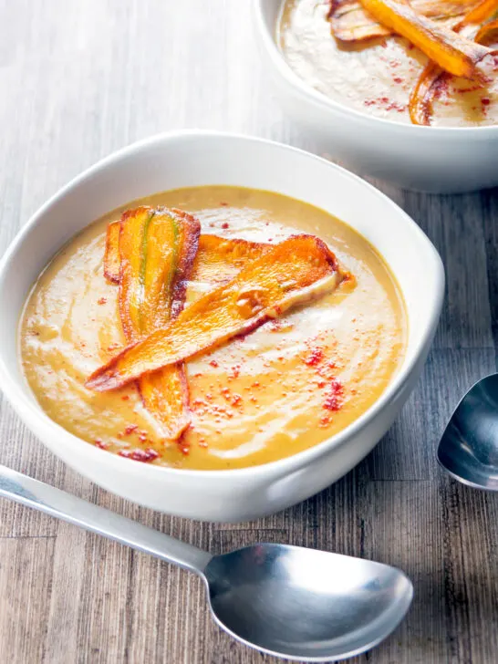 Silky Smooth roasted curried parsnip soup with paprika and fried carrot crisps.