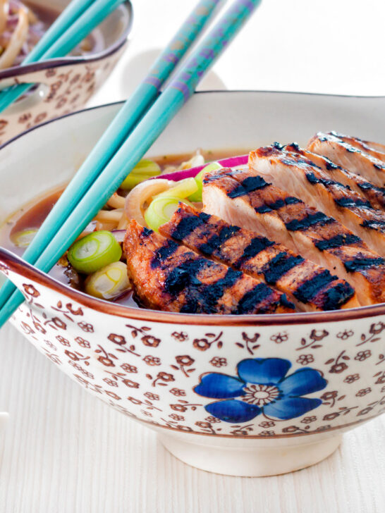 Spicy pork ramen soup with spring onions.