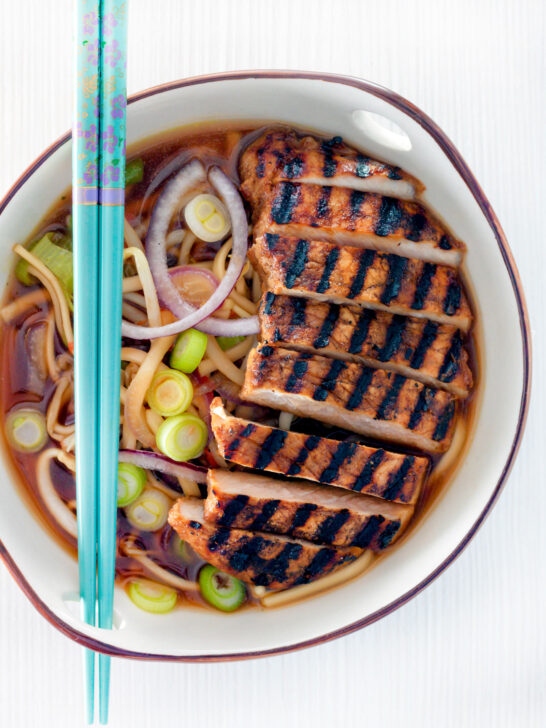 Overhead spicy pork ramen soup.