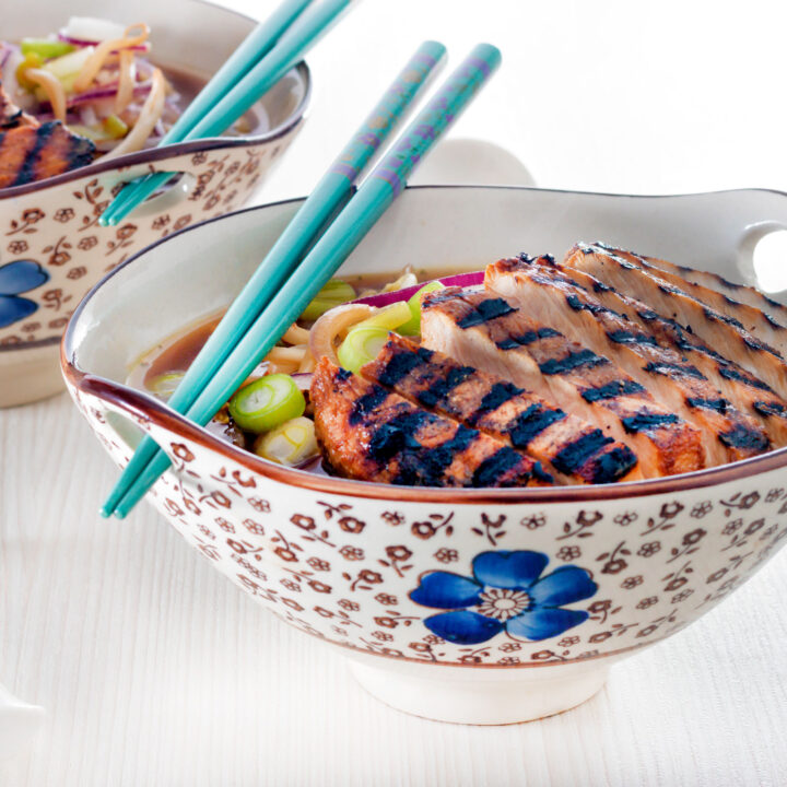 Spicy pork loin ramen noodle soup in a Japanese style bowl.