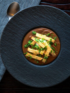 Overhead spicy vegan black bean soup with Mexican influences.