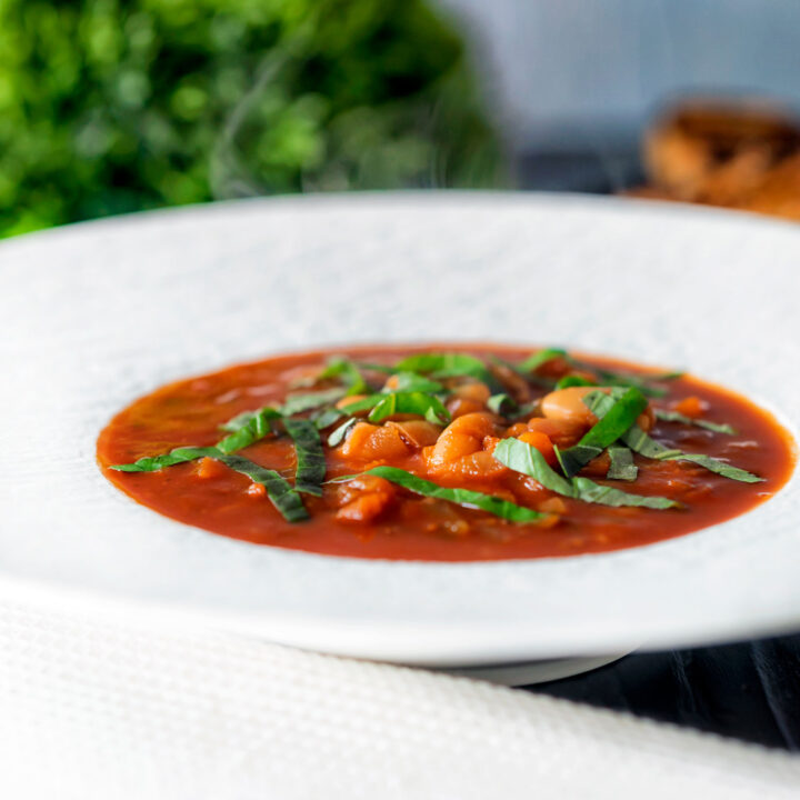 Vegan slow cooker bean soup with tomato and balsamic vinegar.