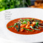 Slow cooker bean and tomato soup with balsamic vinegar featuring a title overlay.