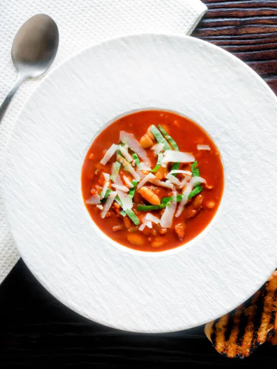 Overhead slow cooker bean and tomato soup with balsamic vinegar.